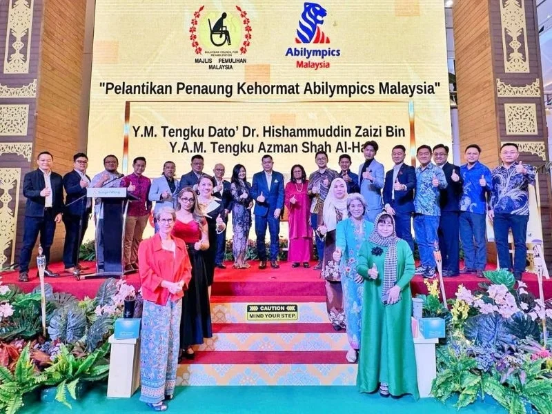 Officials and guests on the Sungei Wang Plaza stage at the appointment of Abilympics Malaysia's honorary patron, April 2025.