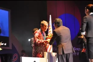 Lim Anuar on stage receiving his Gold Medal at the 2011 International Abilympics in Seoul.